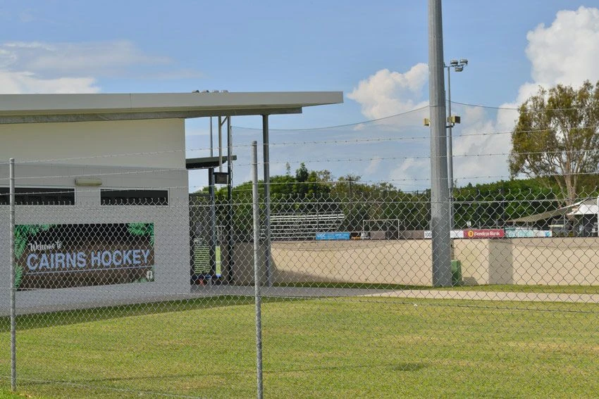 Chain wire fencing along a sporting field