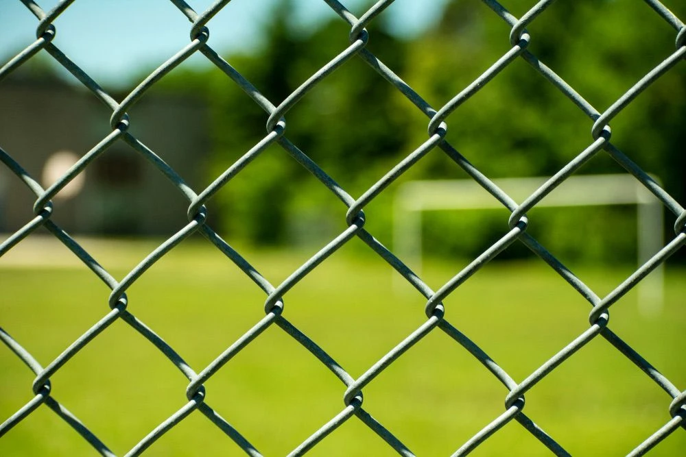 Close view of black PVC coated chain wire mesh