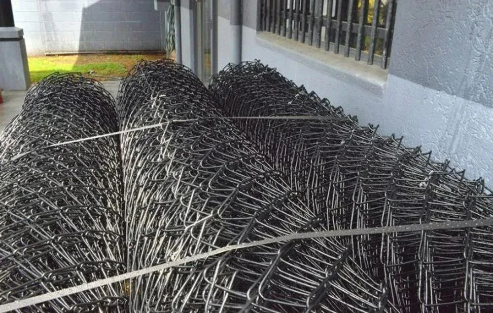 Rolls of chain wire mesh stacked ready for supply